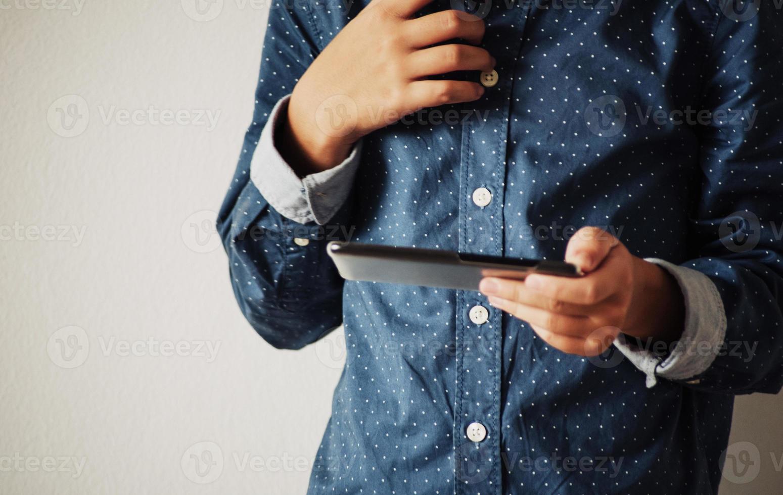 Boy playing games on smartphones, Boy hand holding a smartphone photo