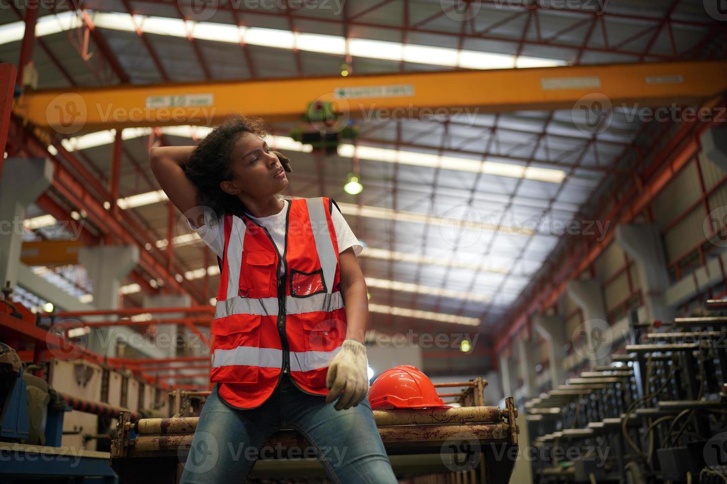 Female worker Foreman or worker work at factory site check up machine or products in site. Engineer or Technician checking Material or Machine on Plant. Industrial and Factory. photo