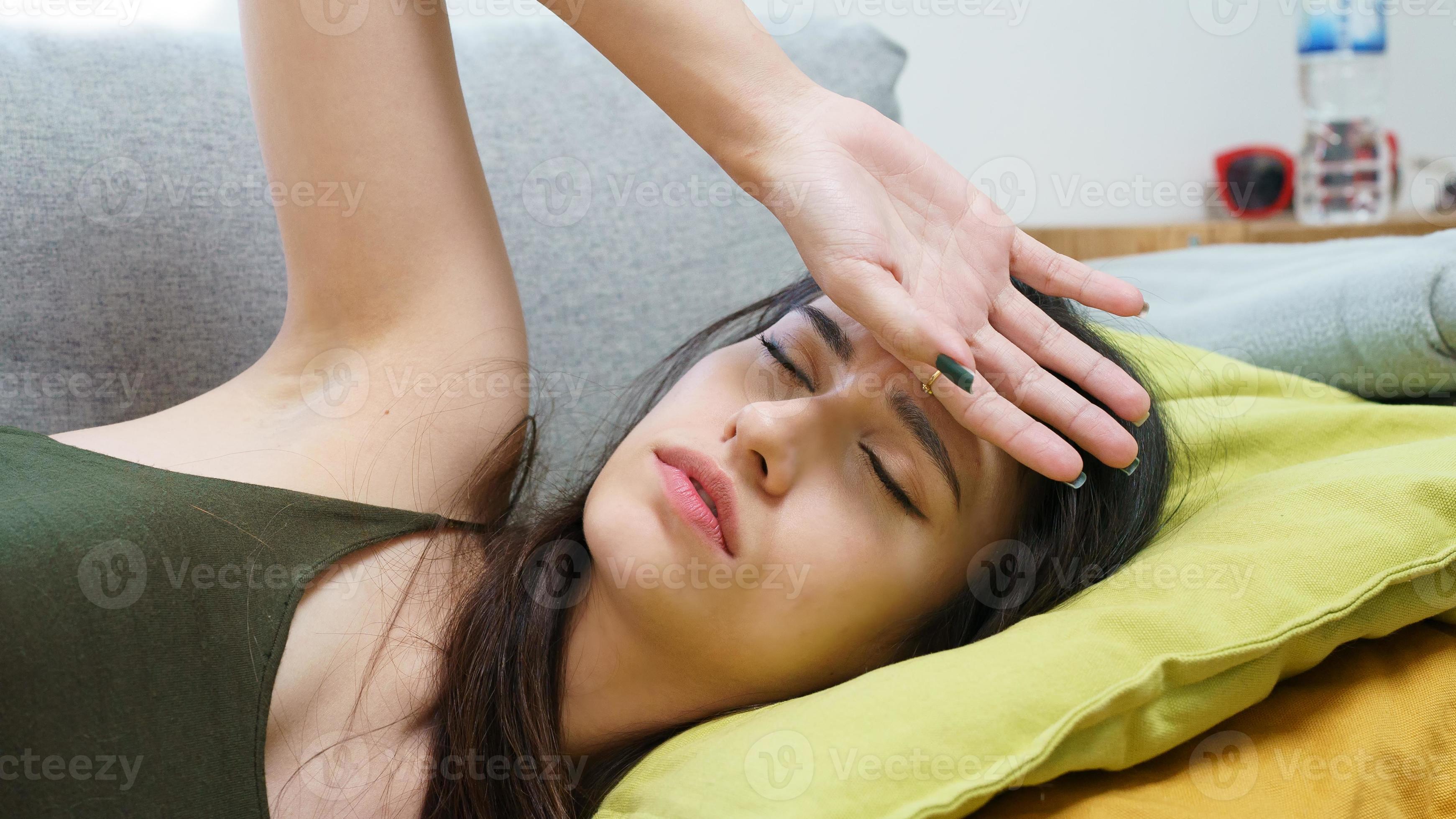 Women feel sick lying on sofa. 7069818 Stock Photo at Vecteezy