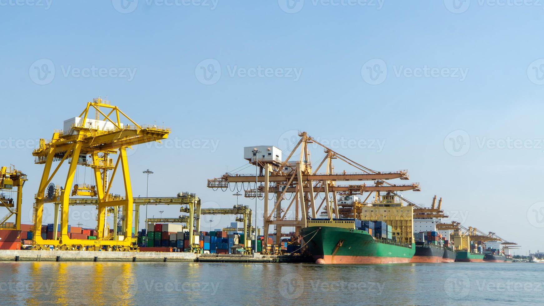 Container loading in a Cargo freight ship with industrial crane. Container ship in import and export business logistic company. Industry and Transportation concept. photo