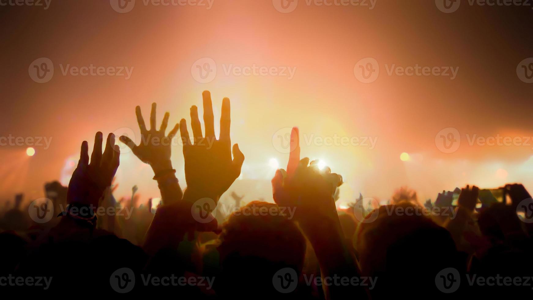 Concert Music festival Concert. Crowd Happy and Joyful and Applauding or Clapping. Celebration party festival happiness. Blurry night club. Concert Show with DJ Music festival EDM on Stage photo