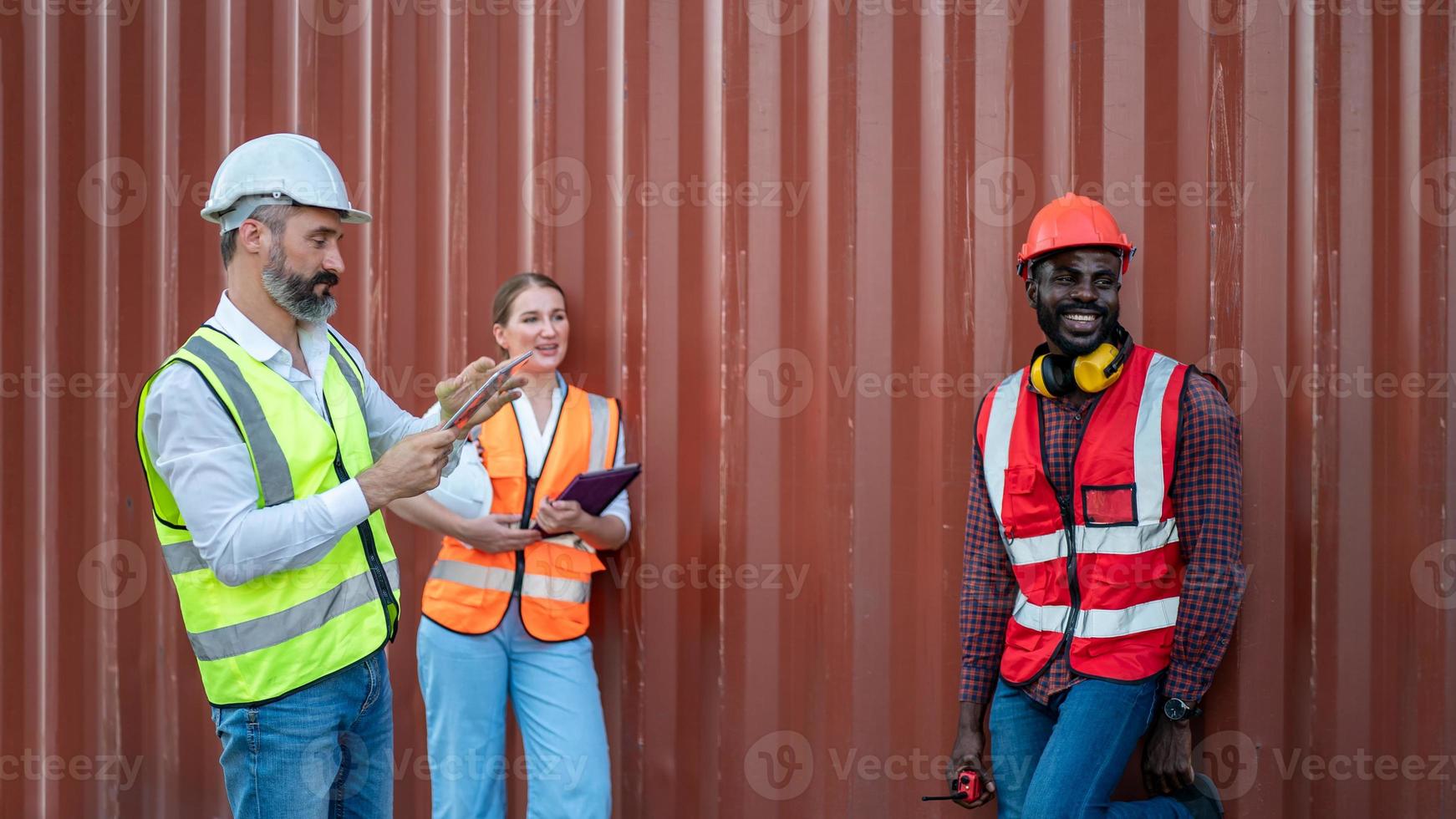 Foreman control loading Containers box from Cargo freight ship for import export. photo