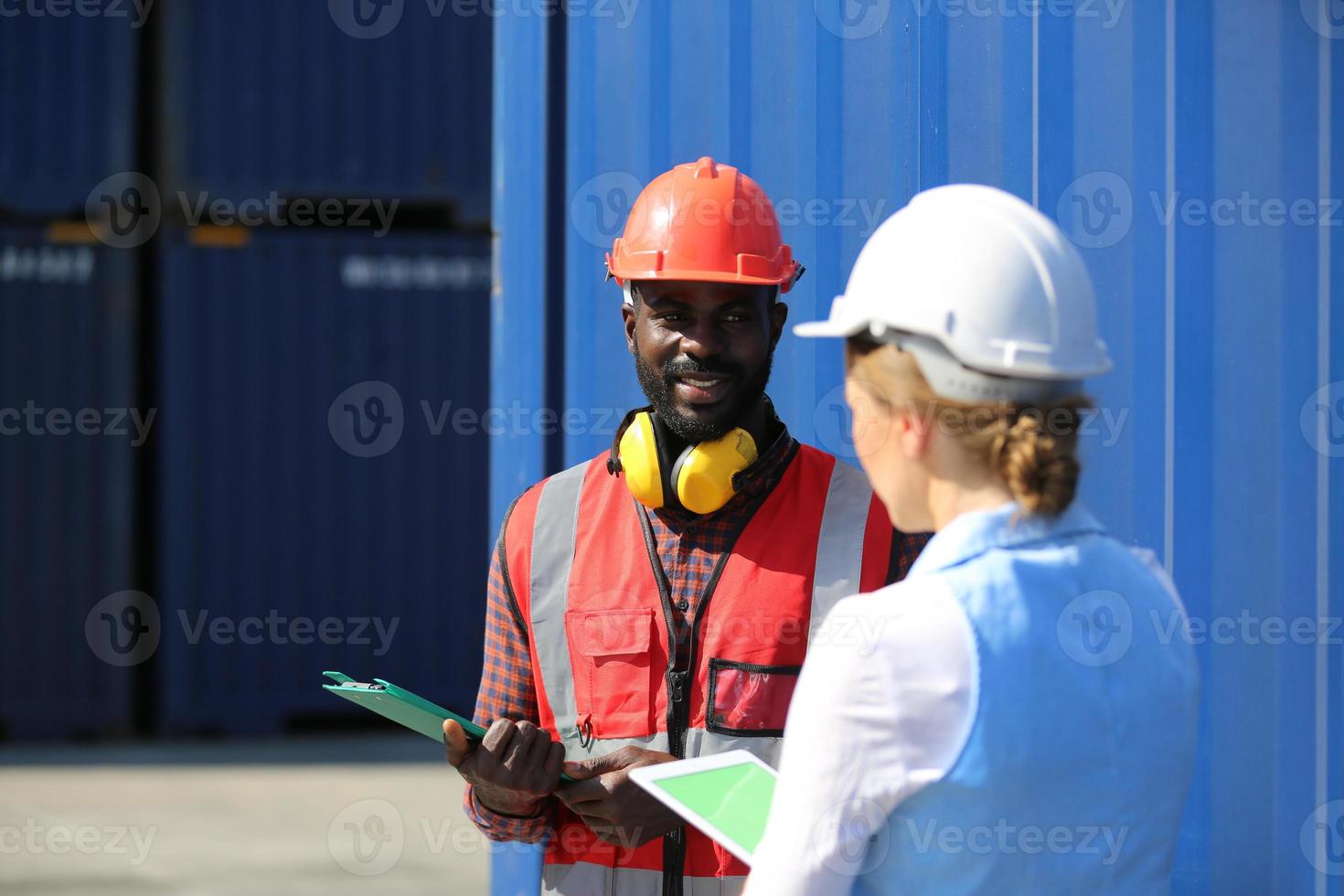 Foreman checking containers in the terminal, at import and export business logistic company. photo