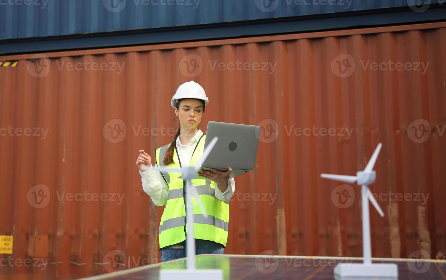 Foreman control loading Containers box from Cargo freight ship for import export. photo