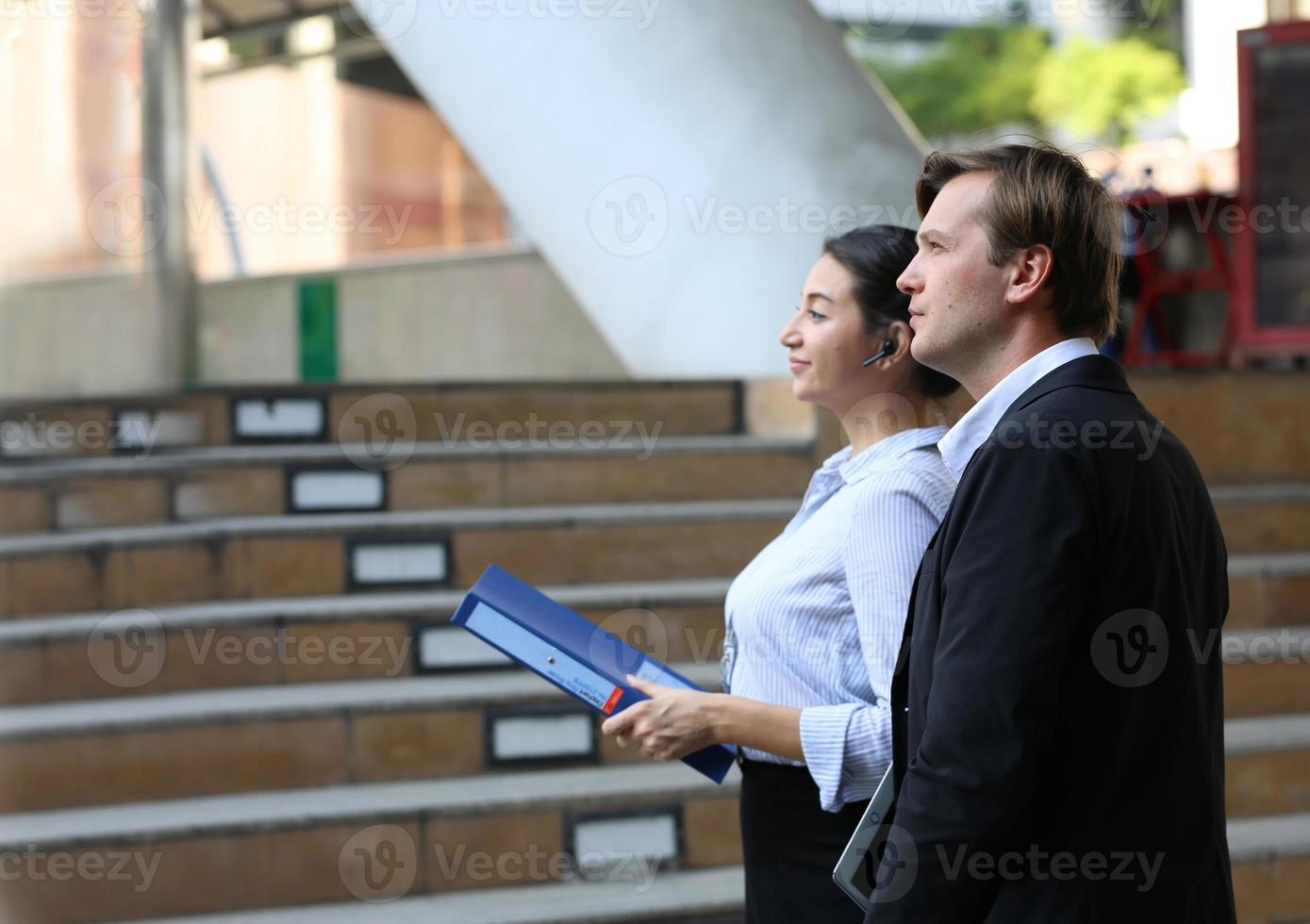 Business people discussing while walking together outdoor photo