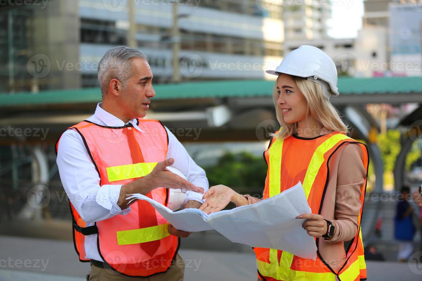 Architect of construction engineer working in construction site and management in the construction site photo