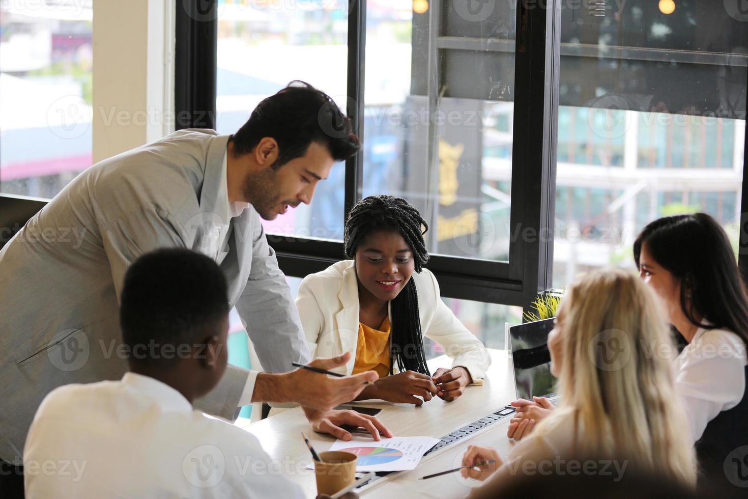 Group of diverse business people collaborating in office or Multiethnic business people in meeting. photo