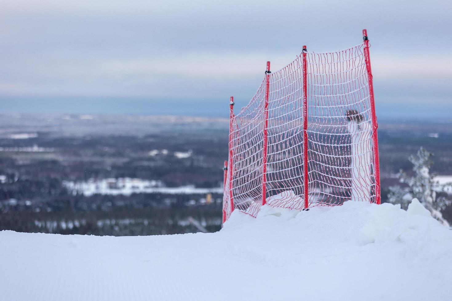 Red safety net on a skiing hill photo