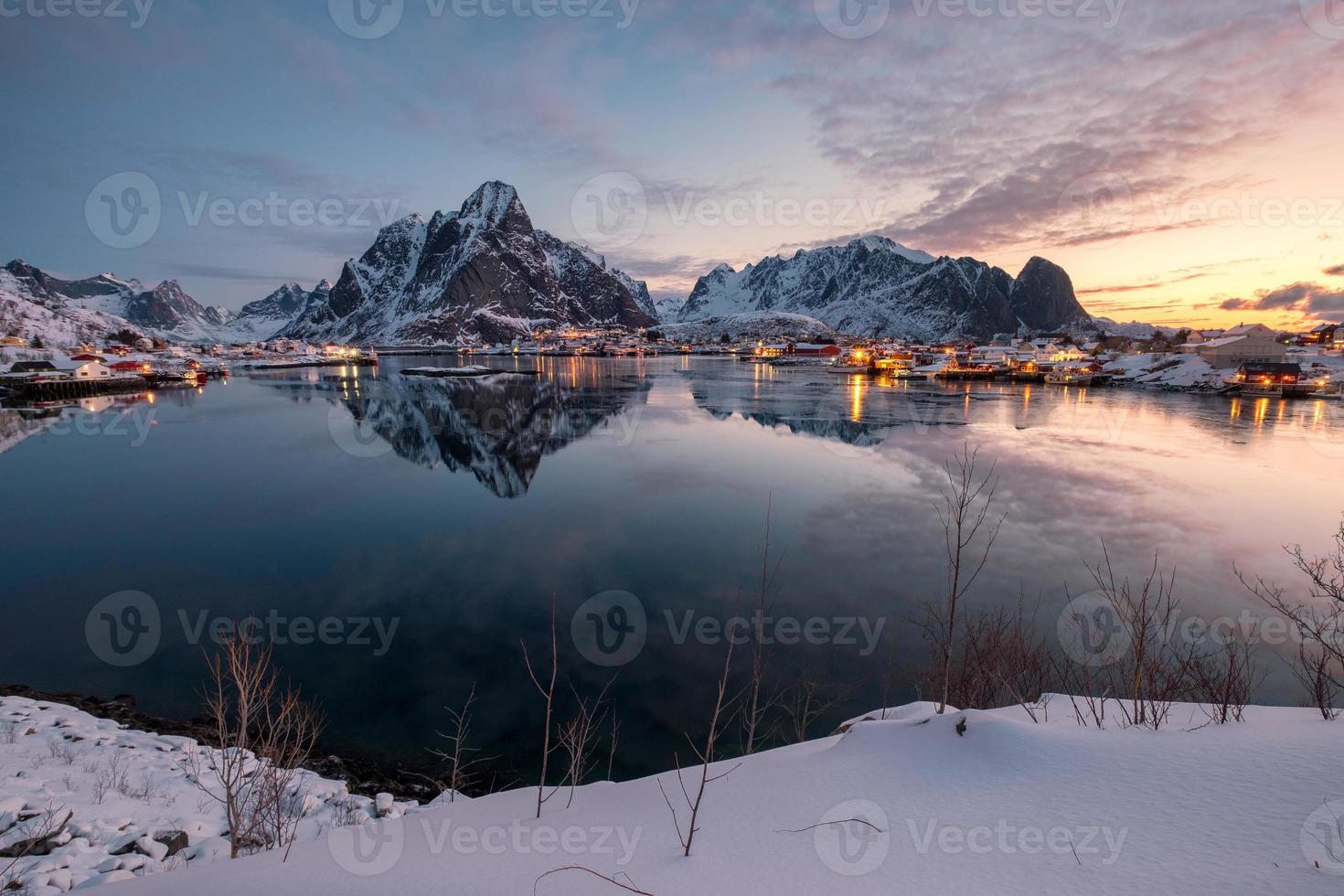 Landscape of fishing village with mountain reflection at Reine photo