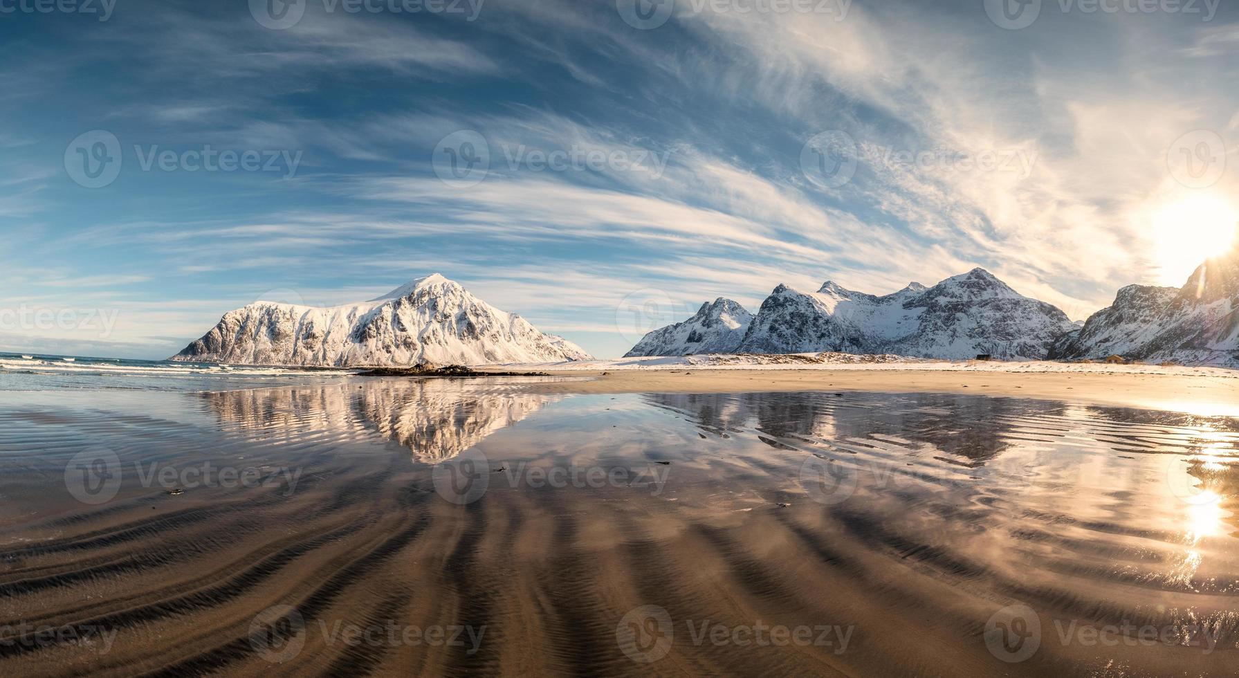 Snow mountain with sand furrows on Skagsanden beach photo