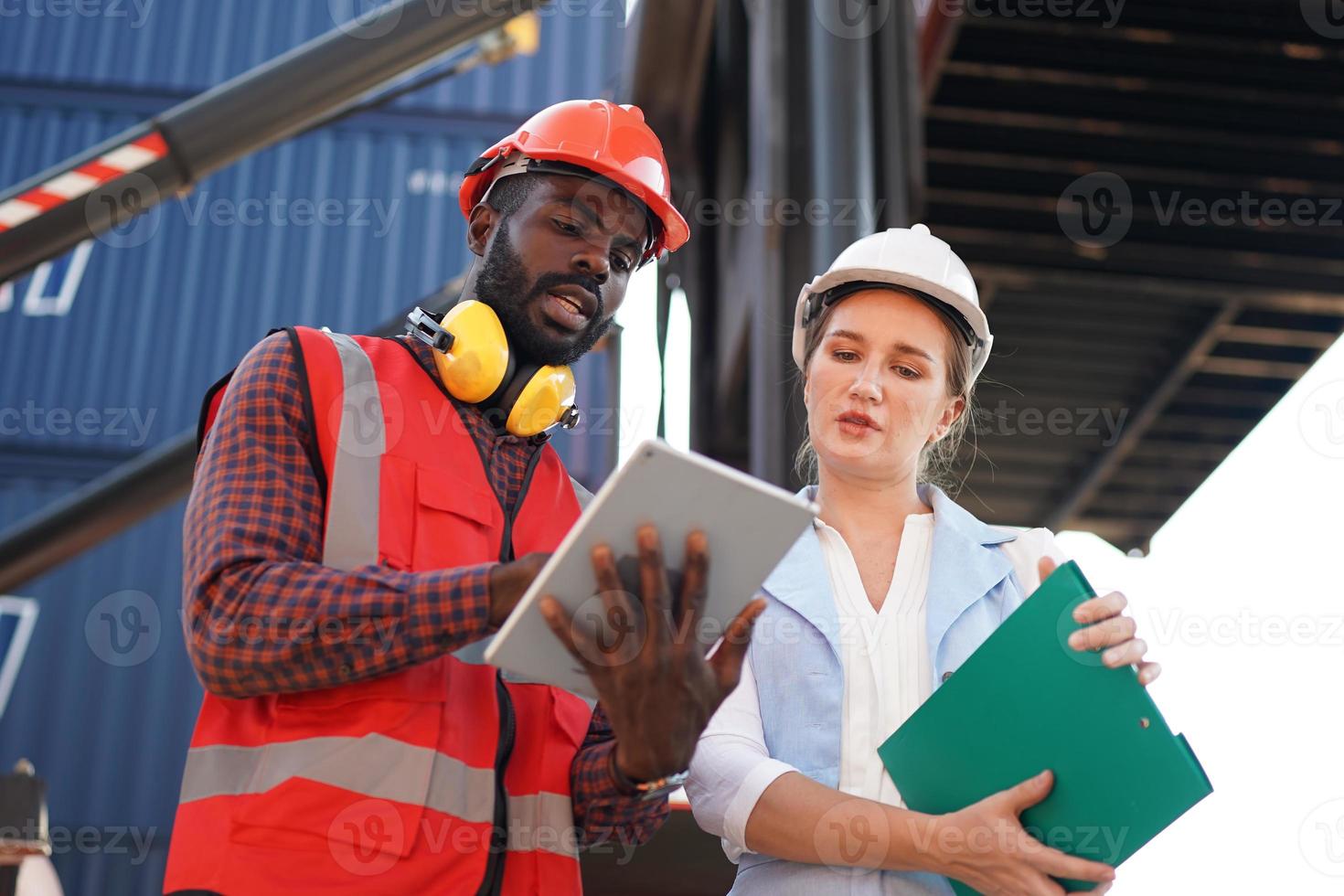 foreman checking containers in the terminal, at import and export business logistic company. photo