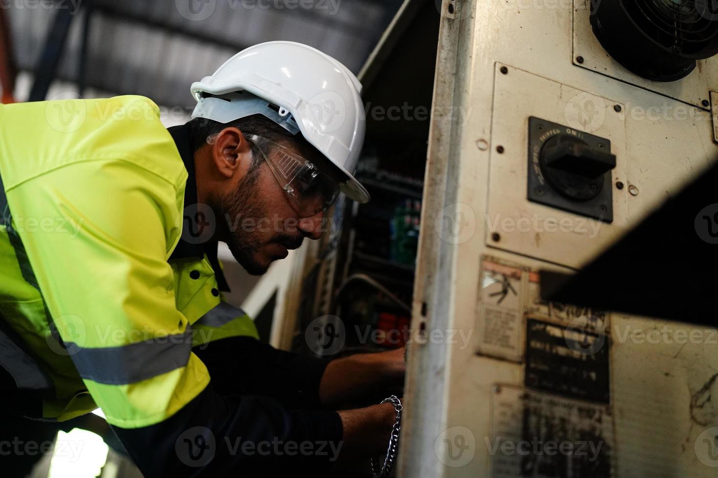 Foreman or worker work at factory site check up machine or products in site. Engineer or Technician checking Material or Machine on Plant. Industrial and Factory. photo