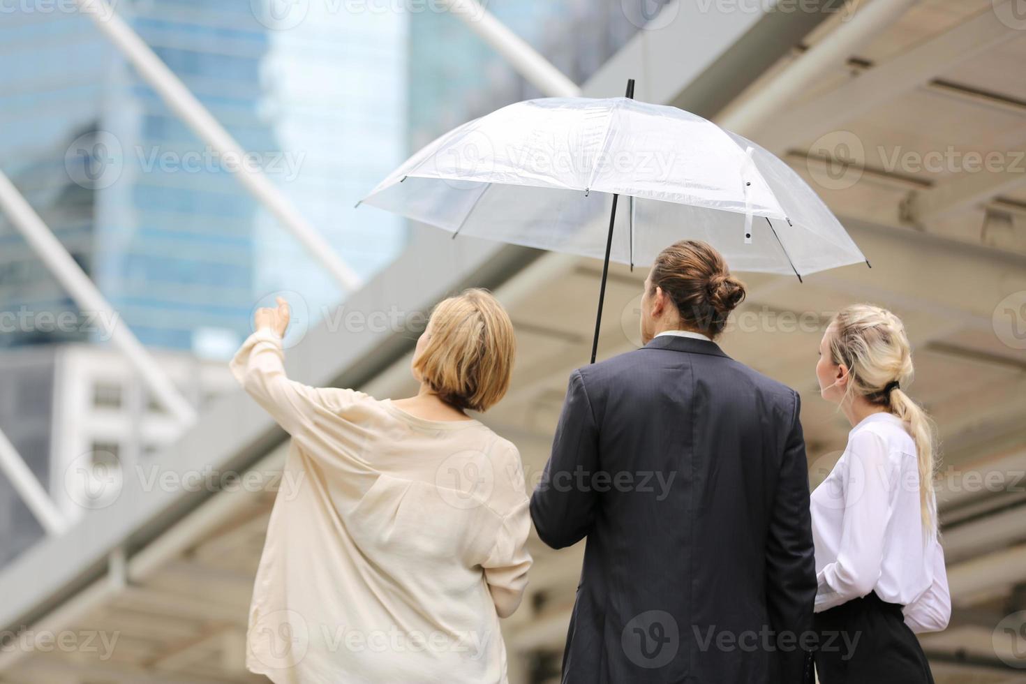 Business people discussing while walking together outdoor photo