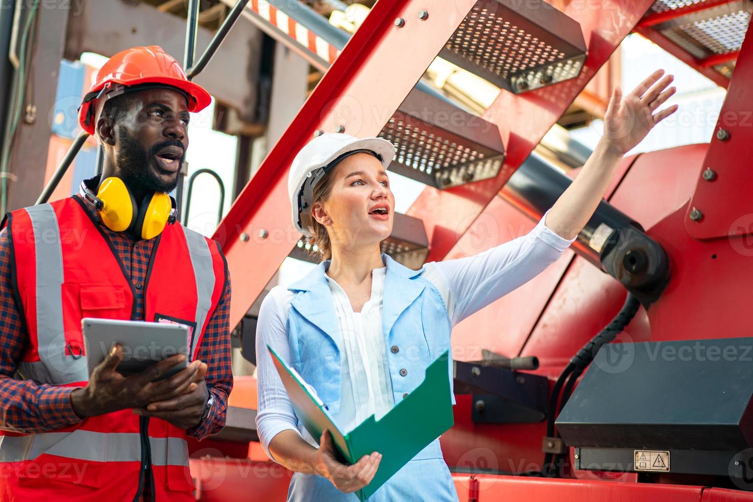 Foreman checking containers in the terminal, at import and export business logistic company. photo