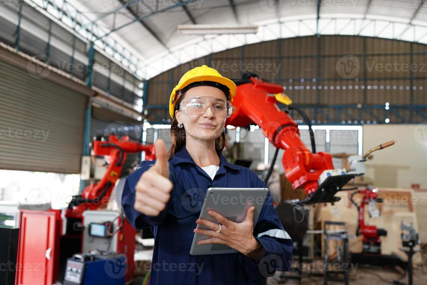 Female empowerment, working female industry worker or engineer woman working in an industrial manufacturing factory. photo