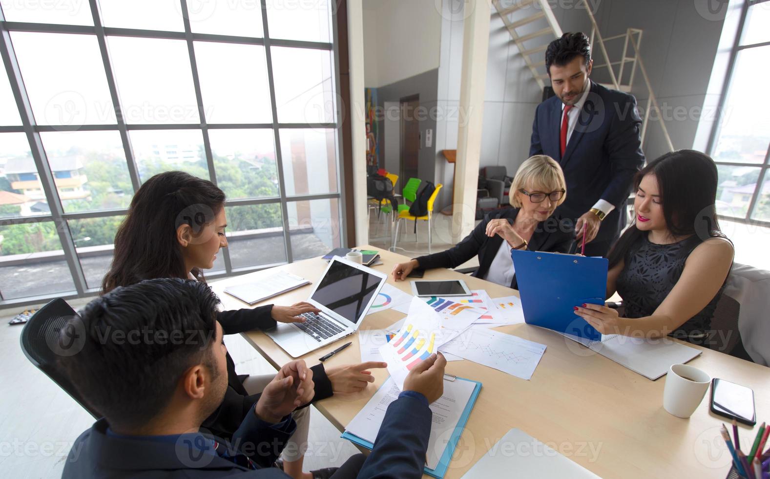 Multiethnic diverse group of business coworkers in team meeting discussion photo