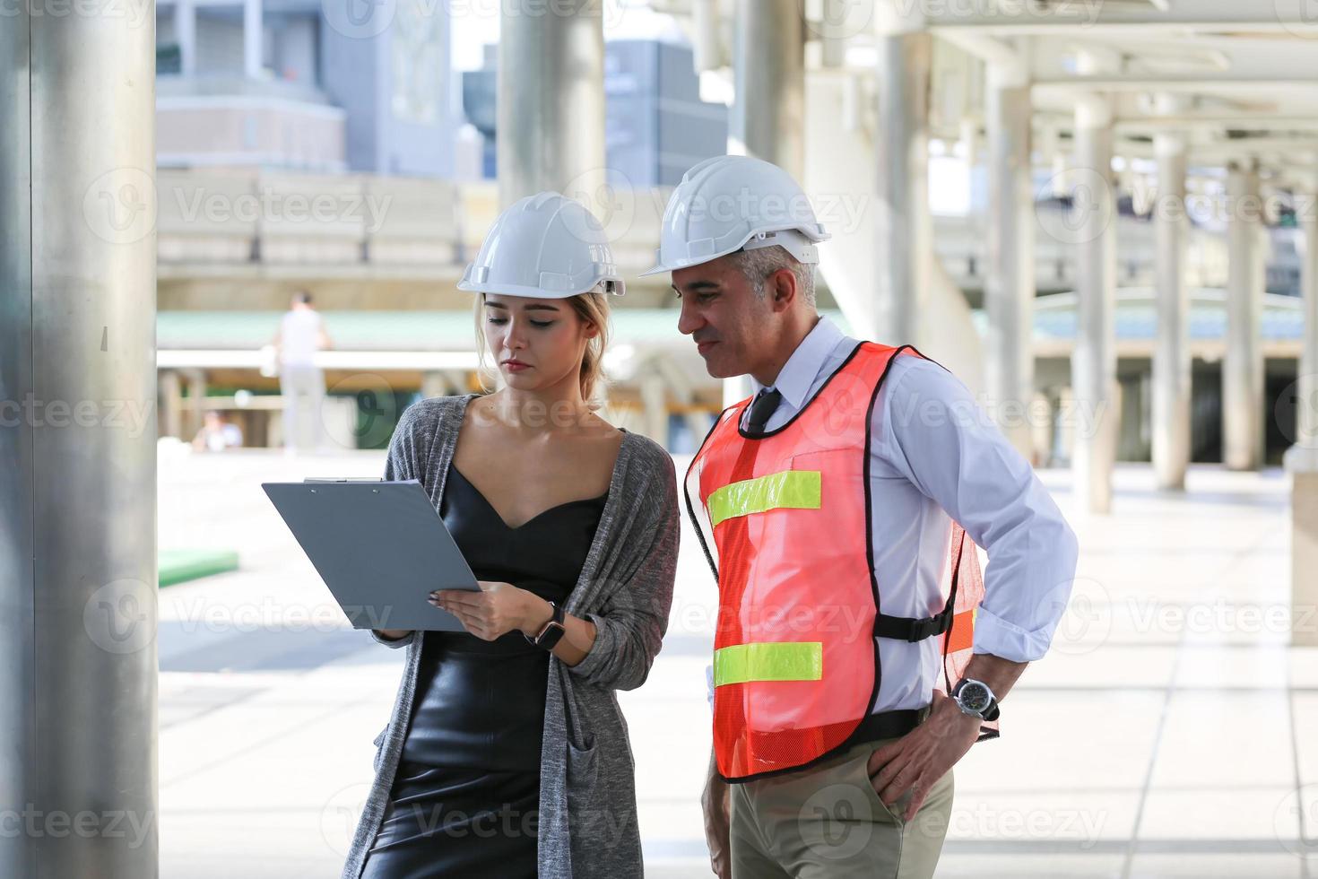 Architect of construction engineer working in construction site and management in the construction site photo