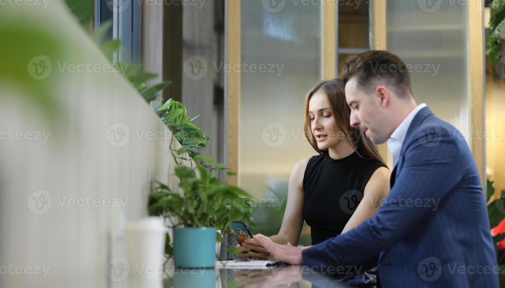 Two of business people discussing and collaborating in office or Multiethnic business people in meeting. photo