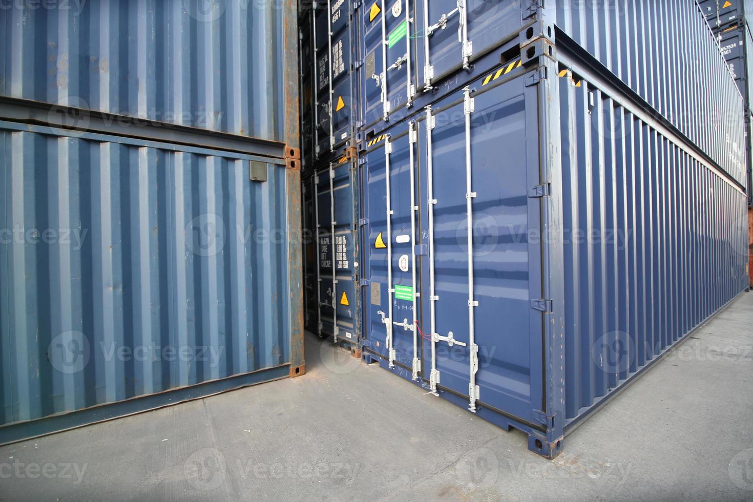 Foreman control loading Containers box from Cargo freight ship for import export. photo
