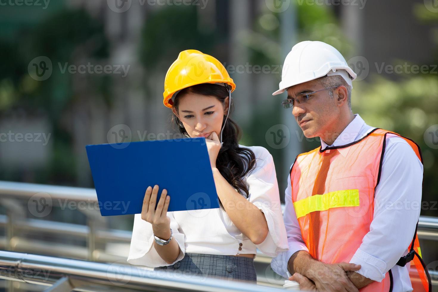 The engineer and business people hand high five against building. The concept of engineering, construction, city life and future. photo