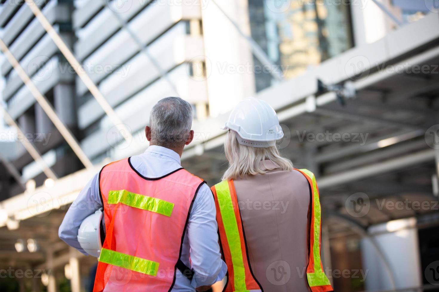 Architect of construction engineer working in construction site and management in the construction site photo