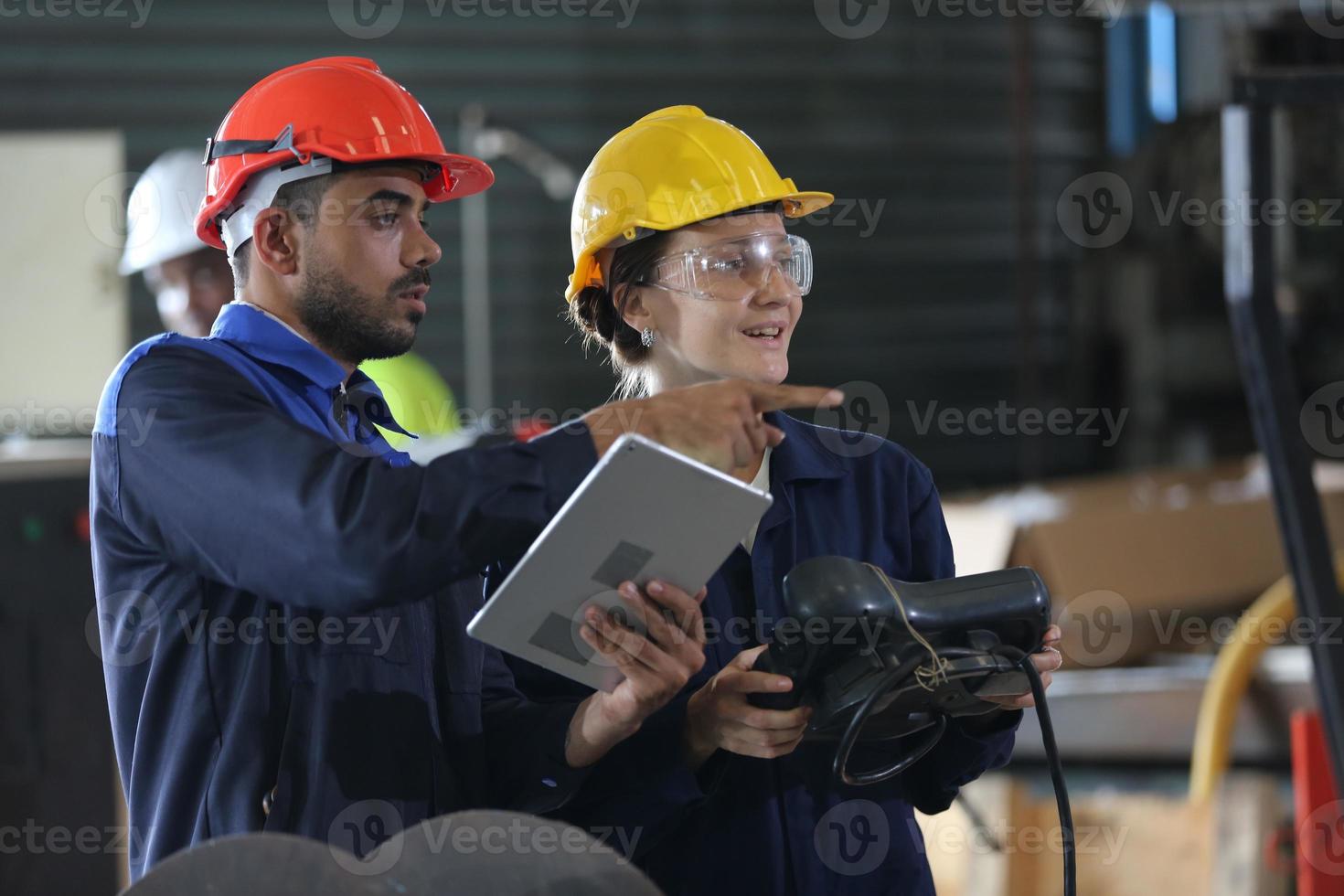 Diverse Multicultural Heavy Industry Engineers and Workers in Uniform check automatics robot arm for Factory Using. Female Industrial Contractor is Using a Tablet Computer. photo