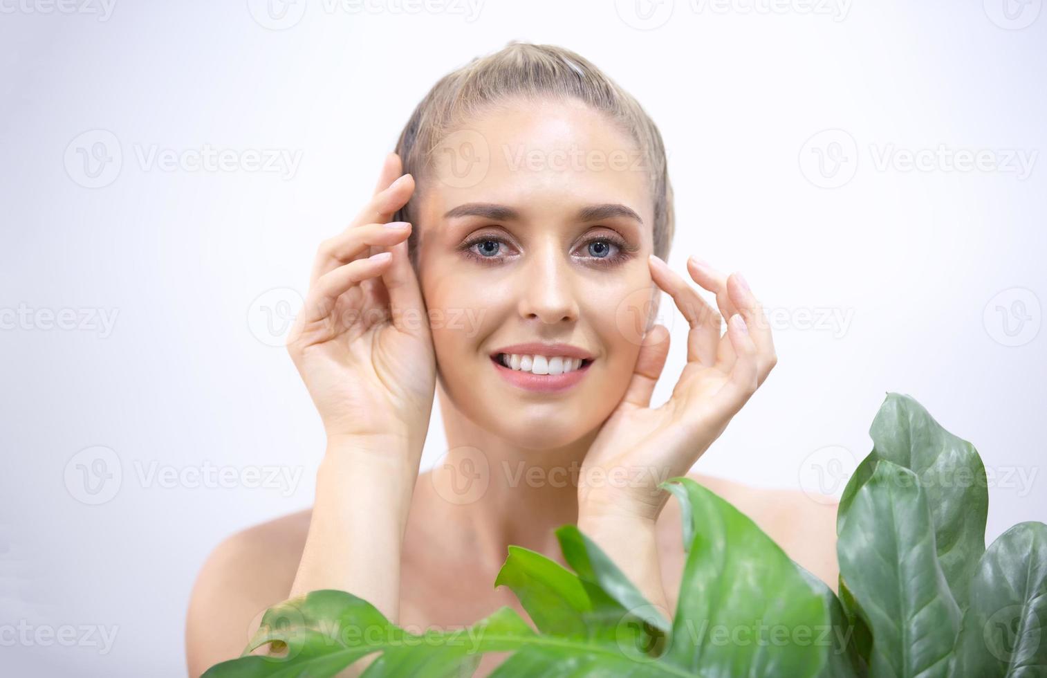 Portrait Of Smiling Young Woman Over white gray  Background photo