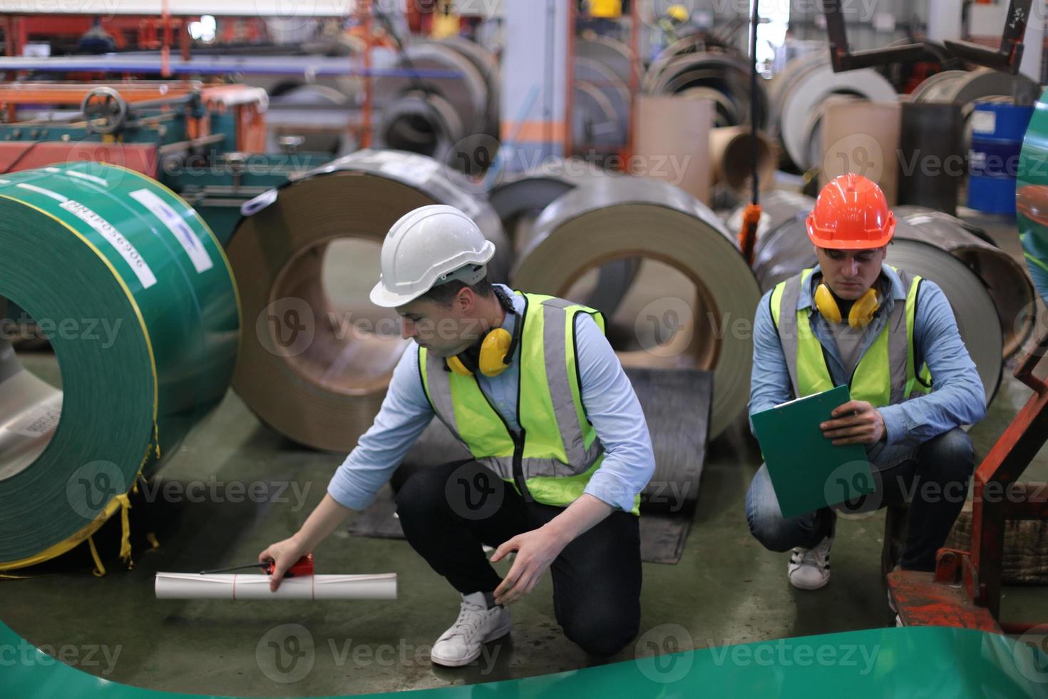 Industry worker Foreman or worker work at factory site check up machine or products in site. Engineer or Technician checking Material or Machine on Plant. Industrial and Factory. photo