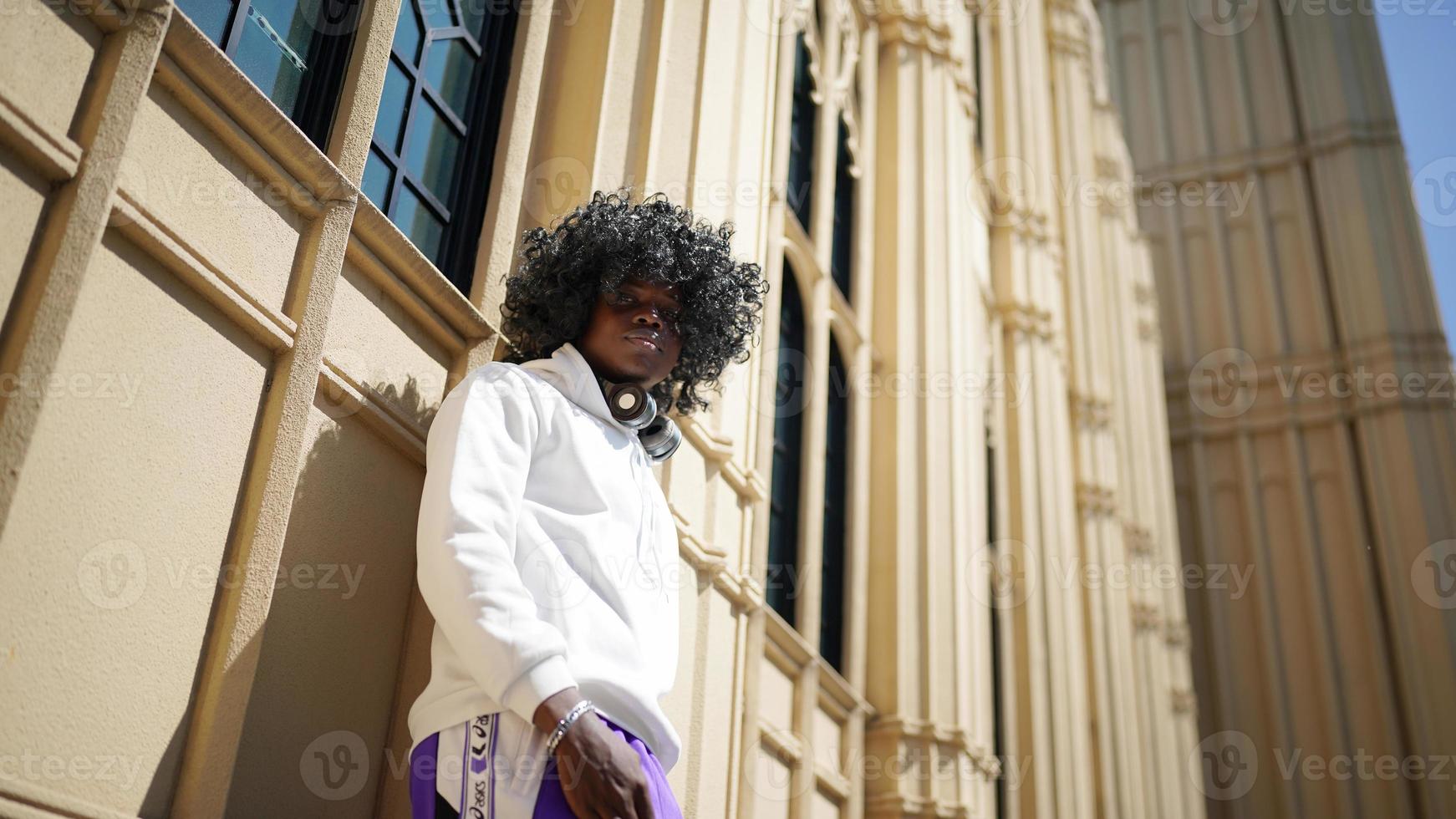 Portrait of young African American hipster man posing at outdoor. photo