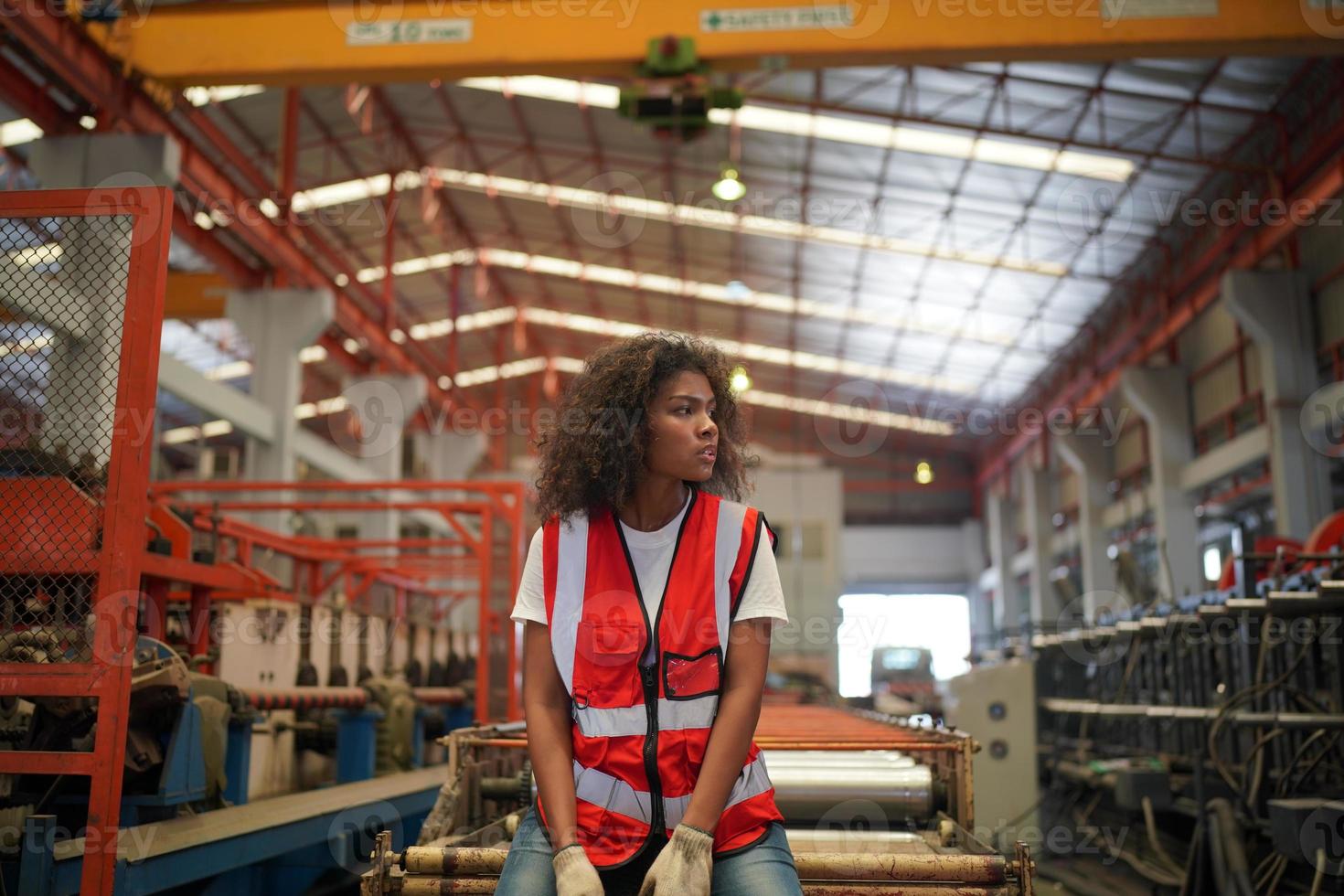 Female worker Foreman or worker work at factory site check up machine or products in site. Engineer or Technician checking Material or Machine on Plant. Industrial and Factory. photo