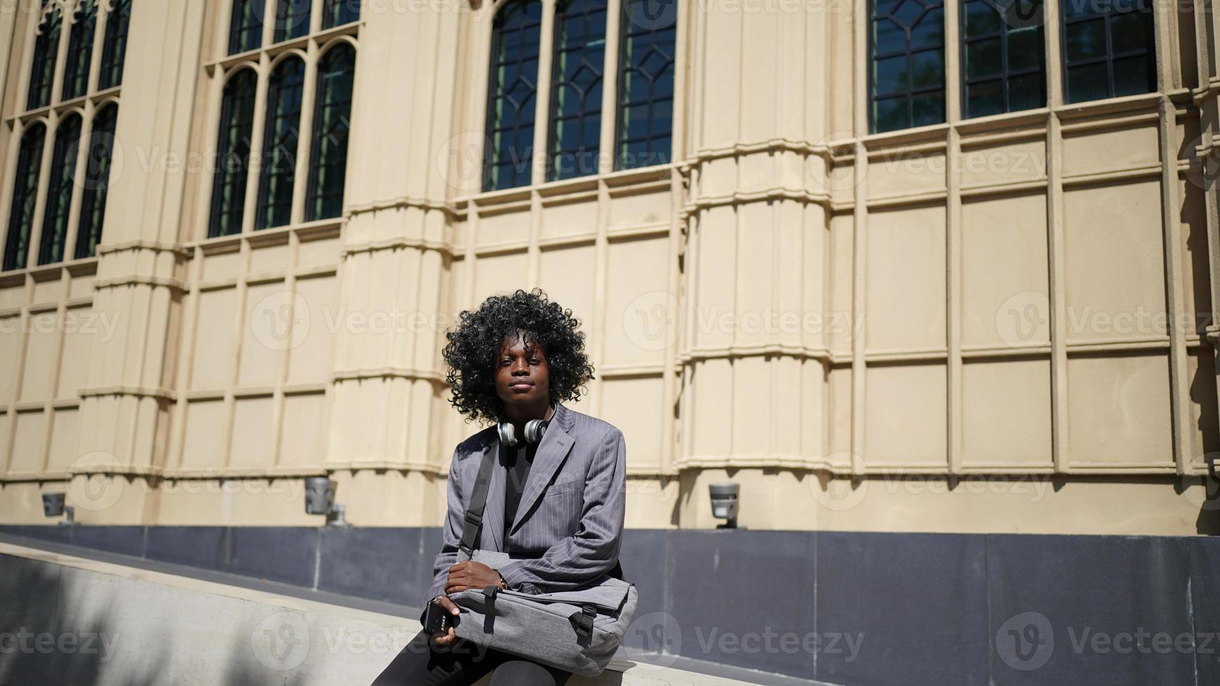 Portrait of young African American hipster man posing at outdoor. photo