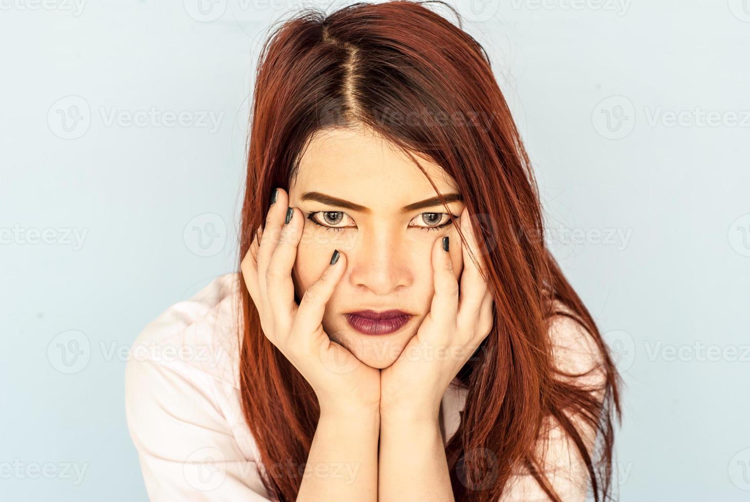 serious young woman pondering over something. photo