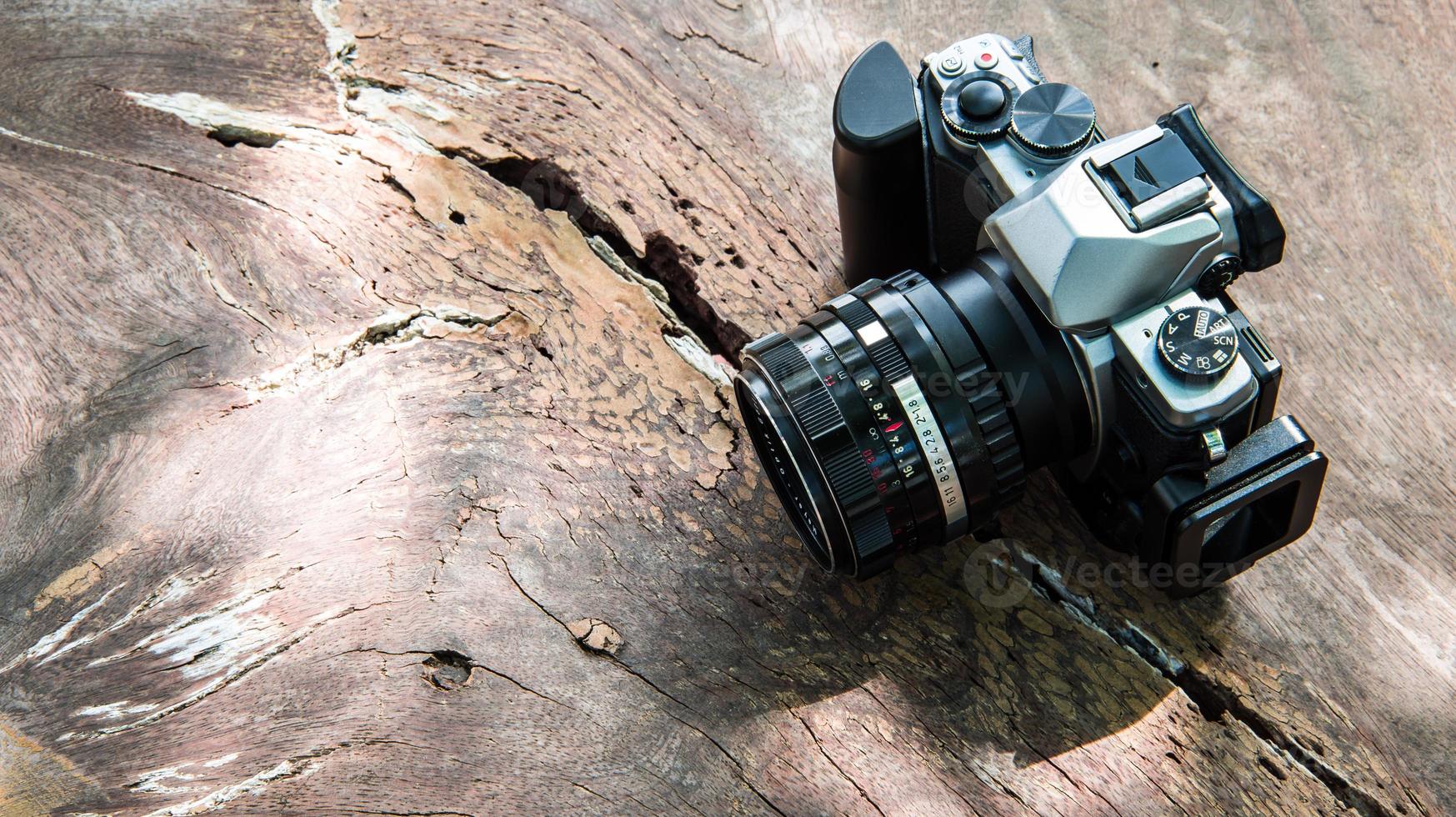 camera on wooden background photo