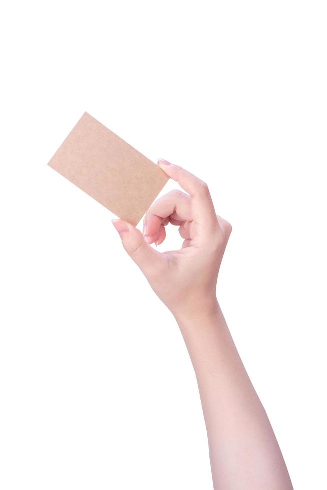 Young asia clean girl hand holding a blank kraft brown paper card template isolated on white background, clipping path, close up, mock up, cut out photo
