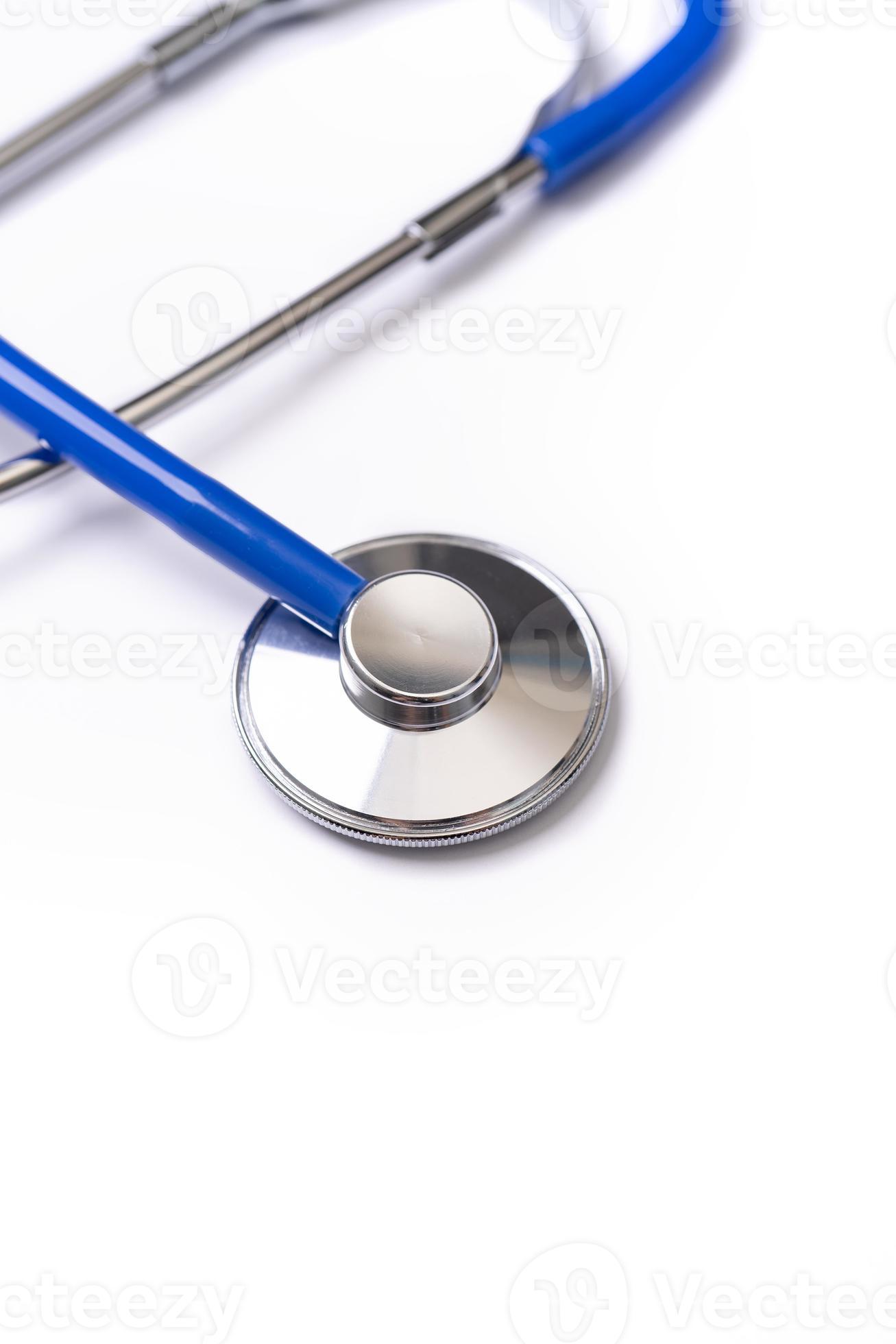 Stethoscope with medical equipment on white background, close up