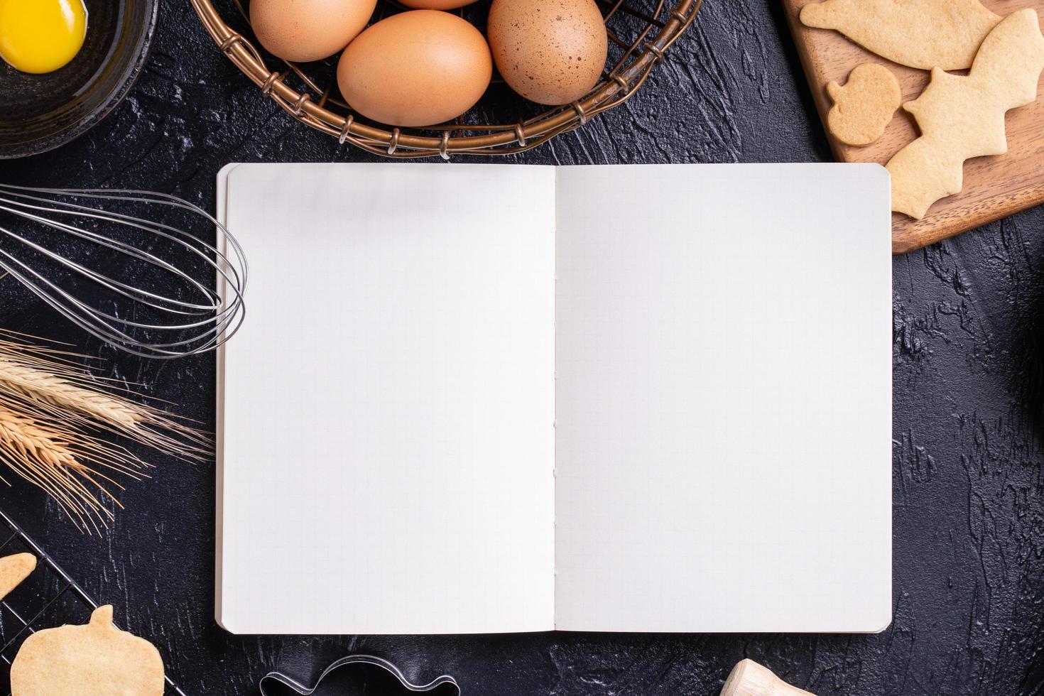 Making cookies cookbook recipe design concept, baking ingredients preparation layout with notebook, top view, flat lay, overhead, mockup copy space. photo