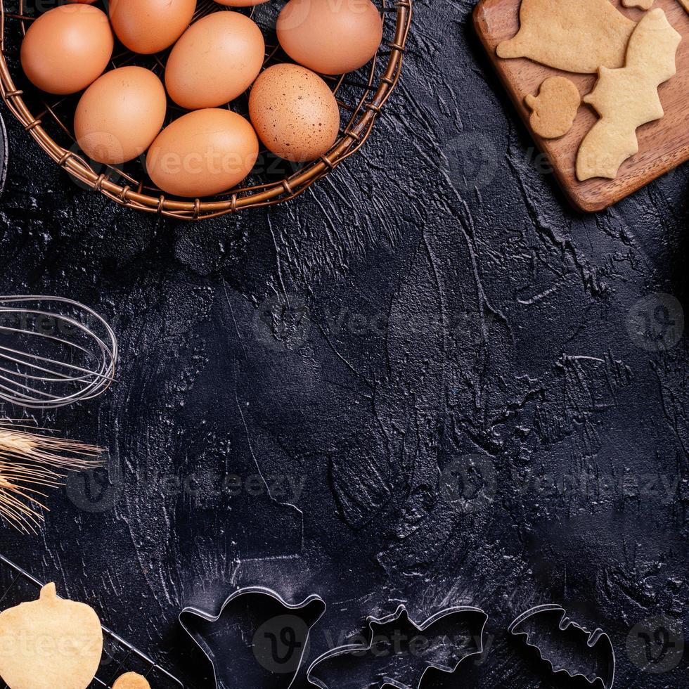 Design concept of making Halloween cookies, baking recipe ingredients layout of preparing party, top view, flat lay, overhead, blank copy space. photo