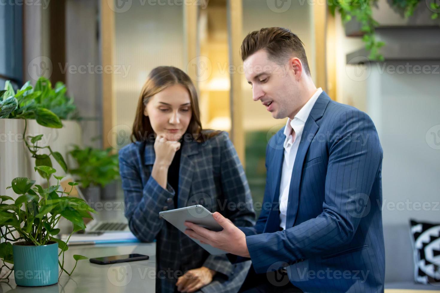 Two of business people discussing and collaborating in office or Multiethnic business people in meeting. photo