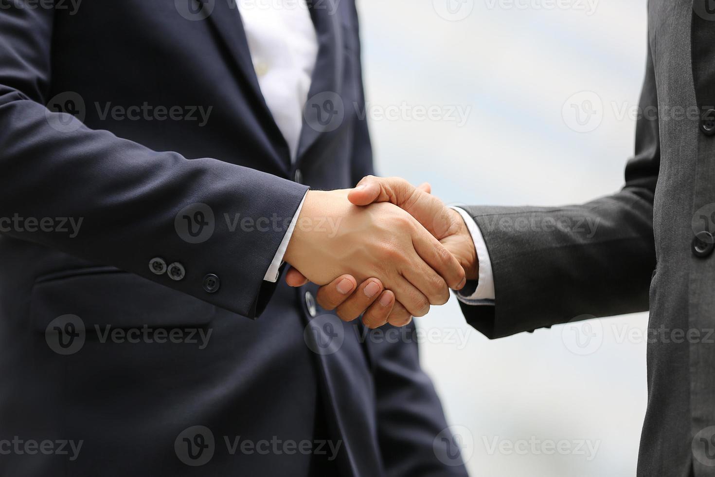 Businessman handshake for teamwork of business merger and acquisition,successful negotiate,hand shake,two businessman shake hand with partner to celebration partnership and business deal concept photo