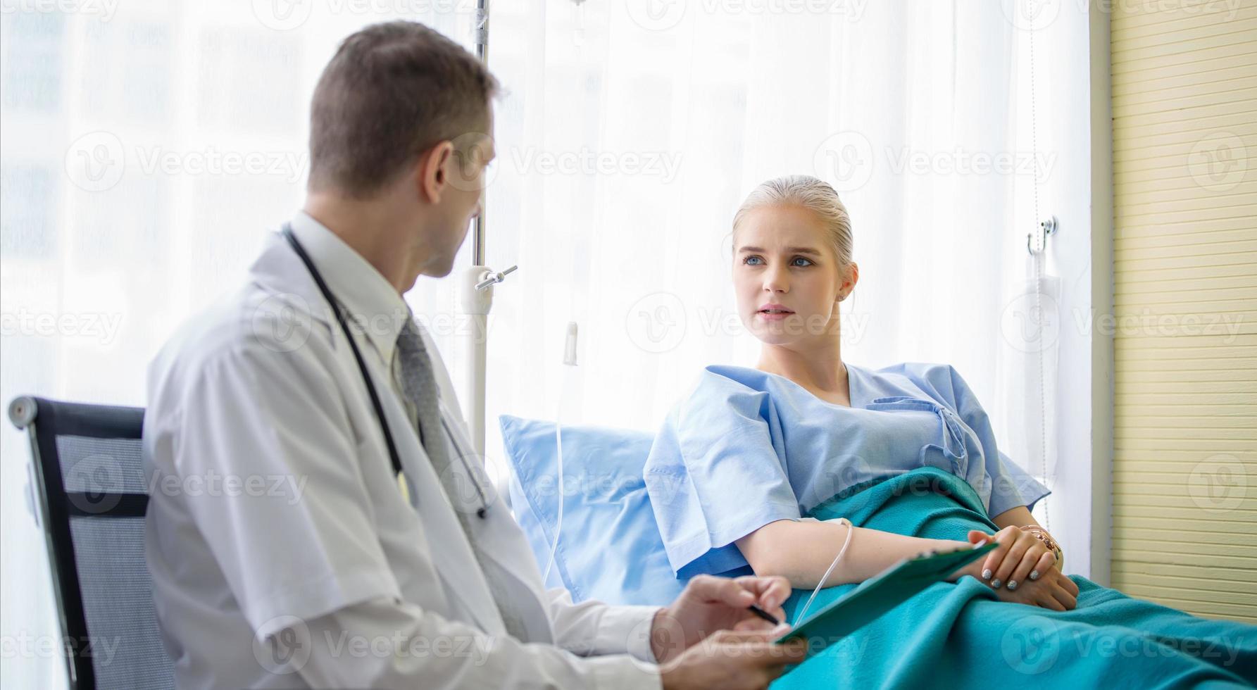 Doctor check up and discuss with patient in clinic or doctor talk with women patient in hospital photo