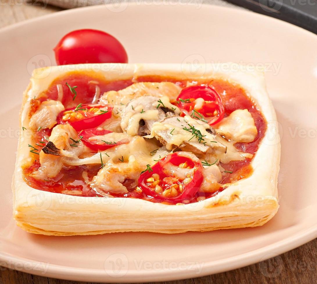 pizza with chicken, tomatoes and mushrooms photo