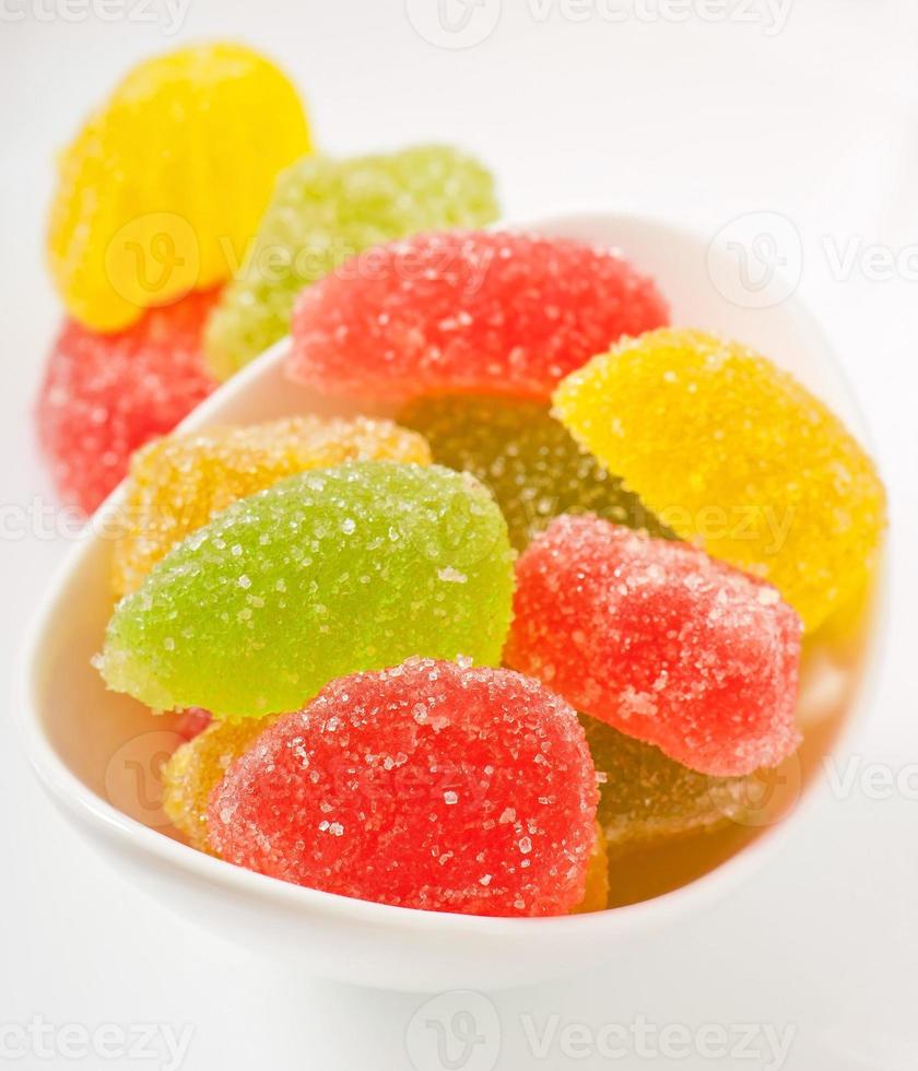 colorful jujube in a white bowl photo