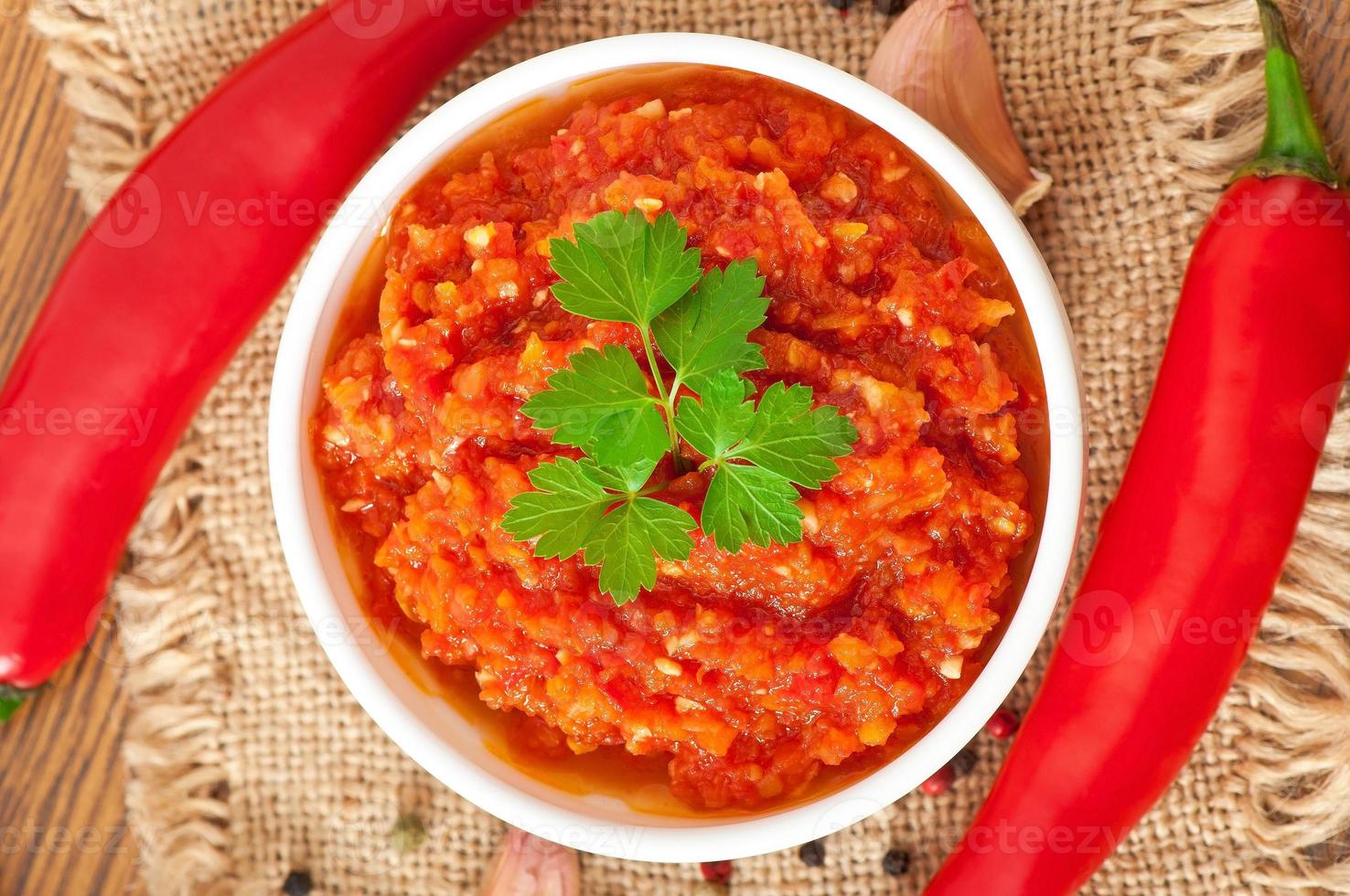 Red hot chili pepper and ingredients for sauce and sauce photo