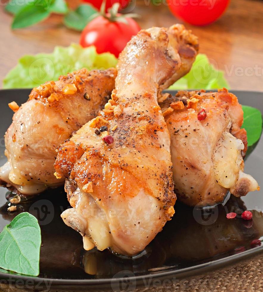 Grilled chicken legs and vegetables photo