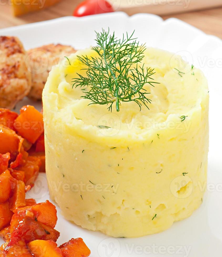 Fried cutlets, stewed pumpkin and mashed potatoes photo