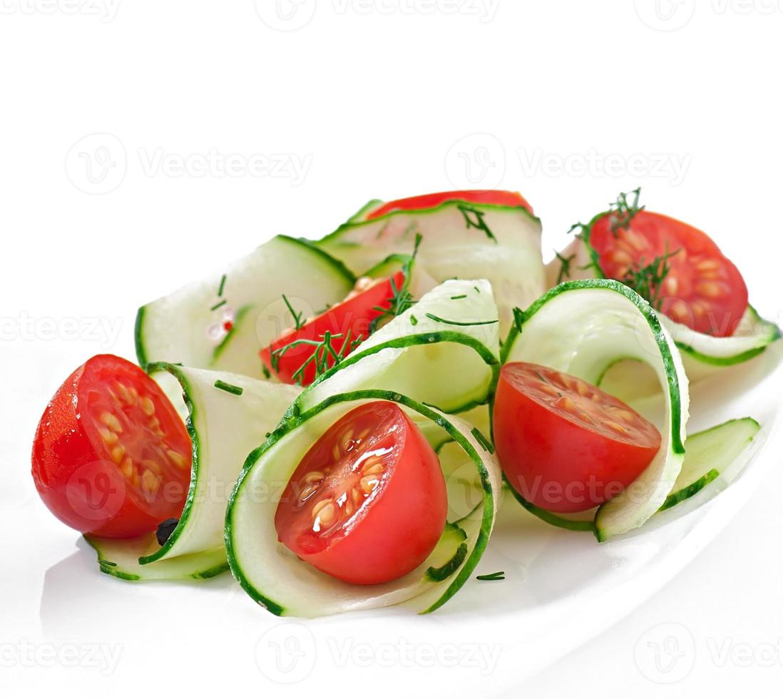 Fresh salad with tomatoes and cucumbers photo