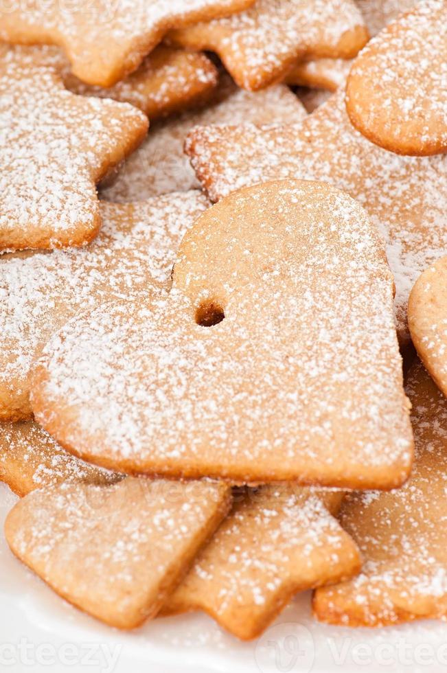 Homemade Christmas cookies sprinkled with powdered sugar photo