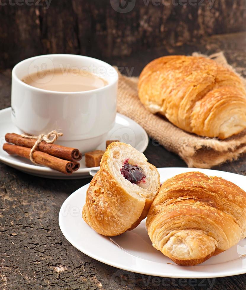 Breakfast with coffee and fresh croissants photo