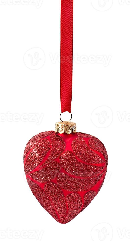 Three Christmas red balls hanging on ribbon isolated on white photo