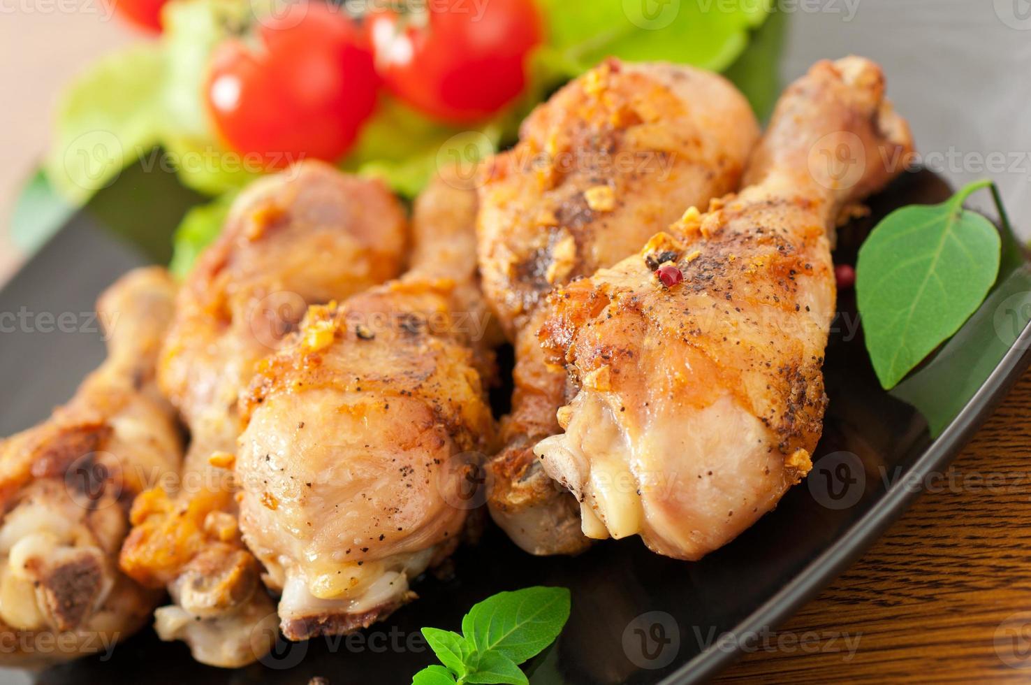 Grilled chicken legs and vegetables photo